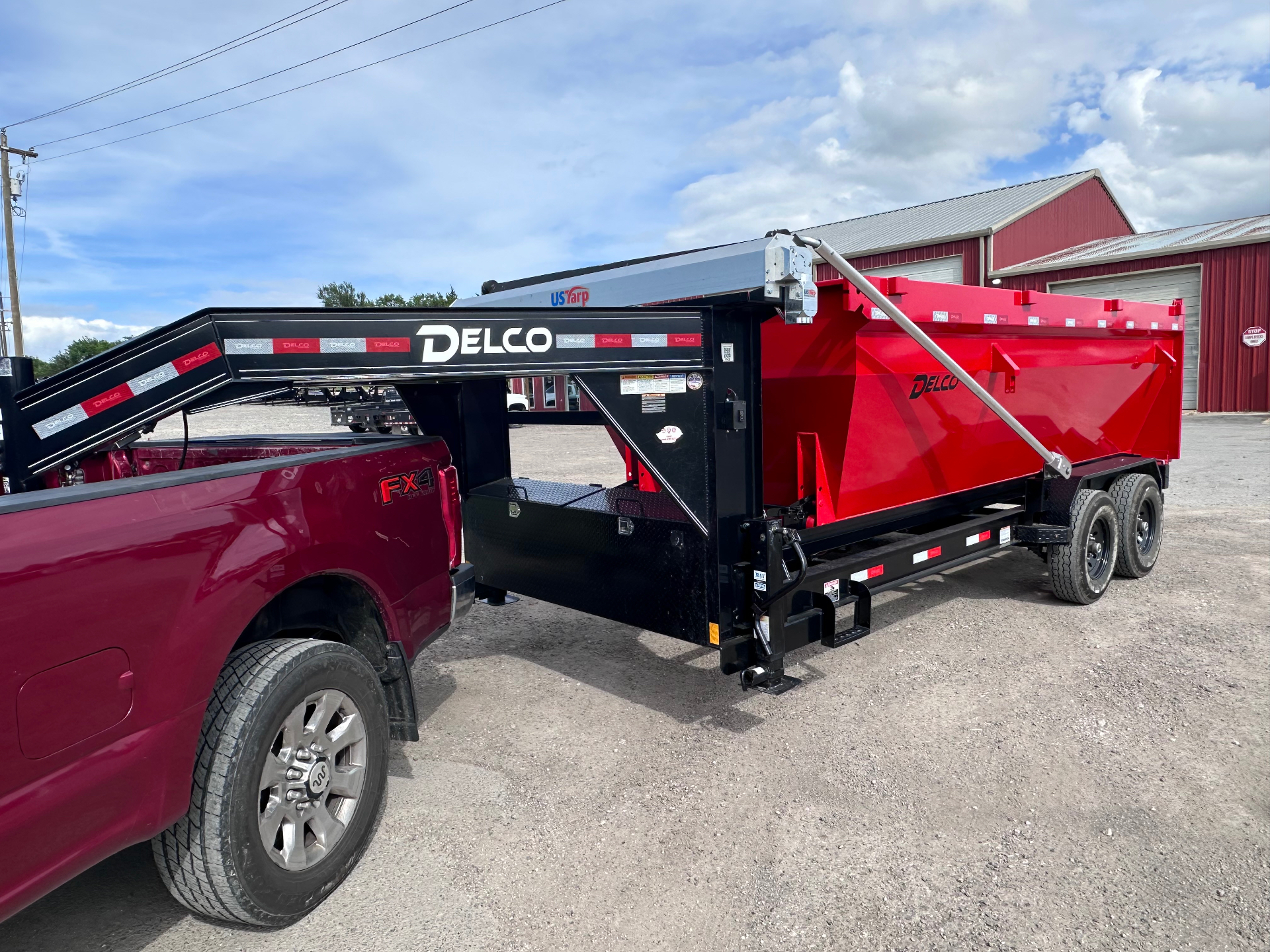Red 16-yard roll-off dump trailer ready for delivery